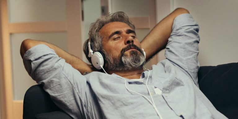 man listening to music on headphones